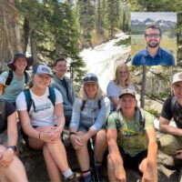 2025 SIHA Crew in front of a waterfall.