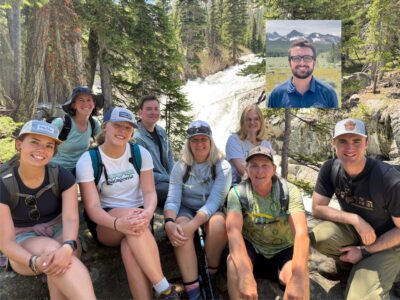 2025 SIHA Crew in front of a waterfall.