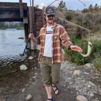 Staff person catching a fish.