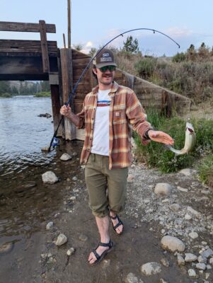 Staff person catching a fish.