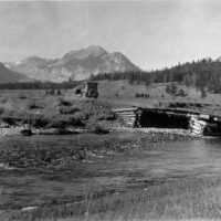 Old car over old bridge in the mountains.