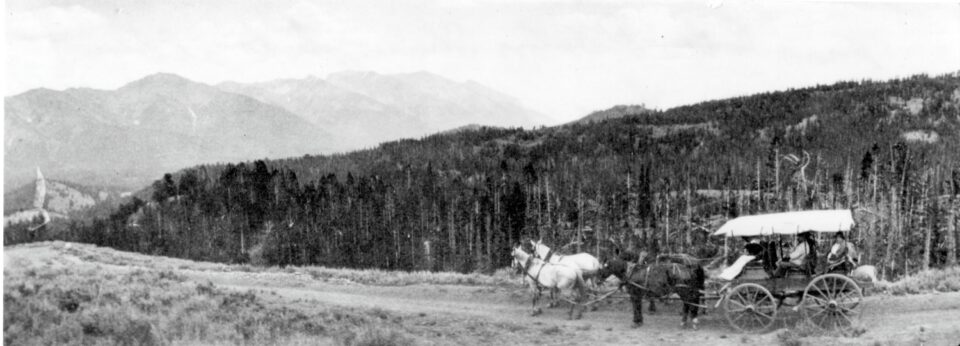 Wagon in front of hills in Wood River Idaho.